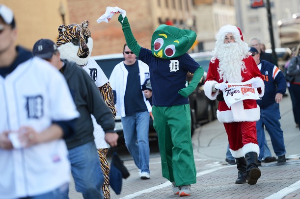 A Detroit fan dressed as Gumby swings his rally towel as he crosses Woodward in downtown Detroit before the start of Game 4 of the ALCS against the Yankees in Detroit on Thursday.
